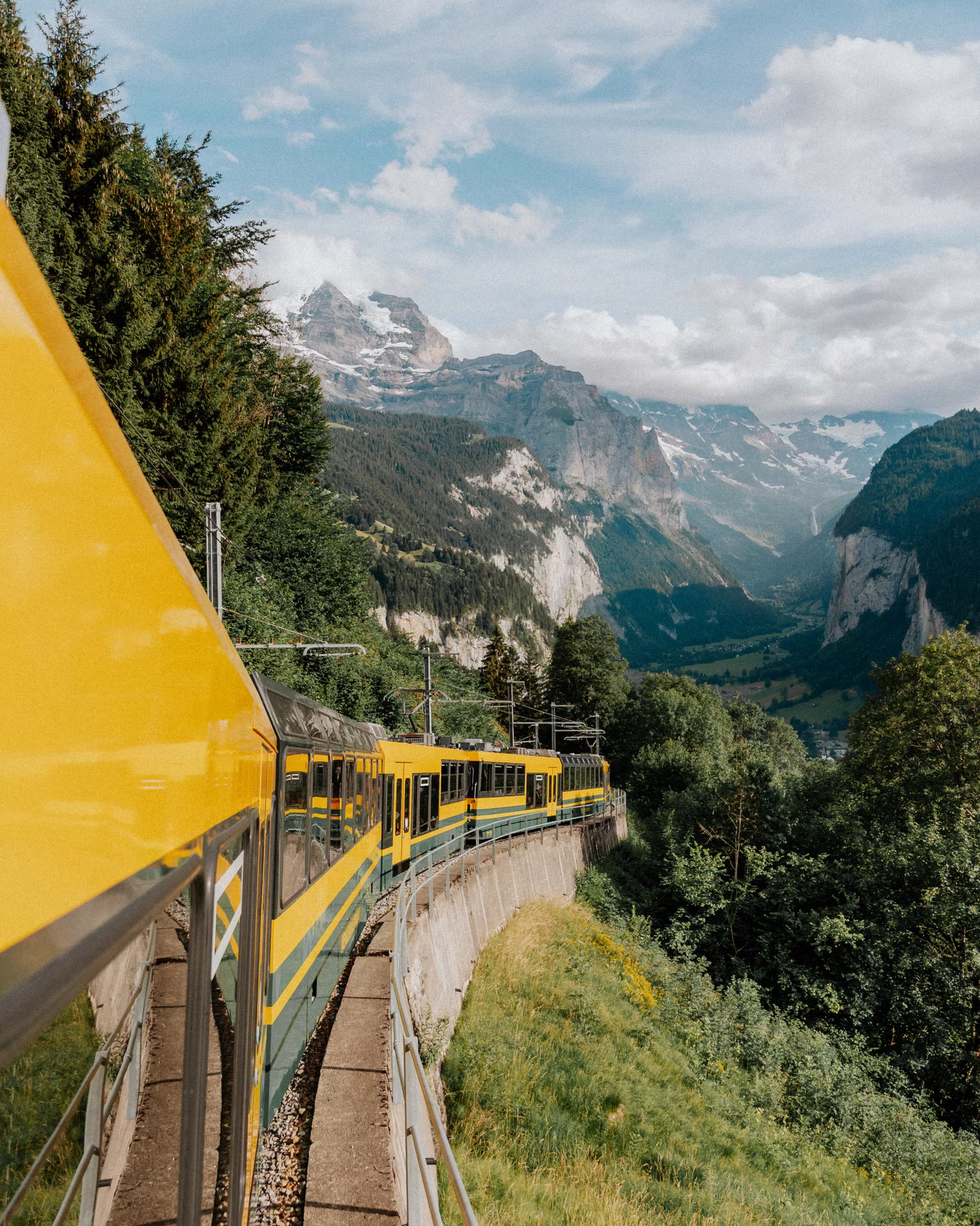 The Wengernalp railway travelling through the mountains above Lauterbrunnen in summer.