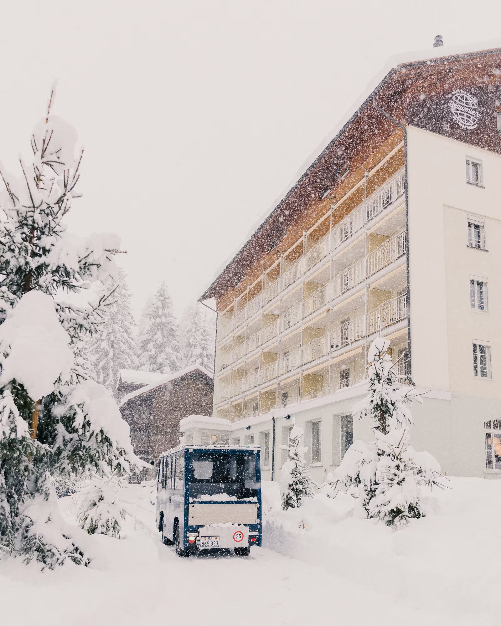 Grand Hotel Belvedere and its electric shuttle in deep winter snow.