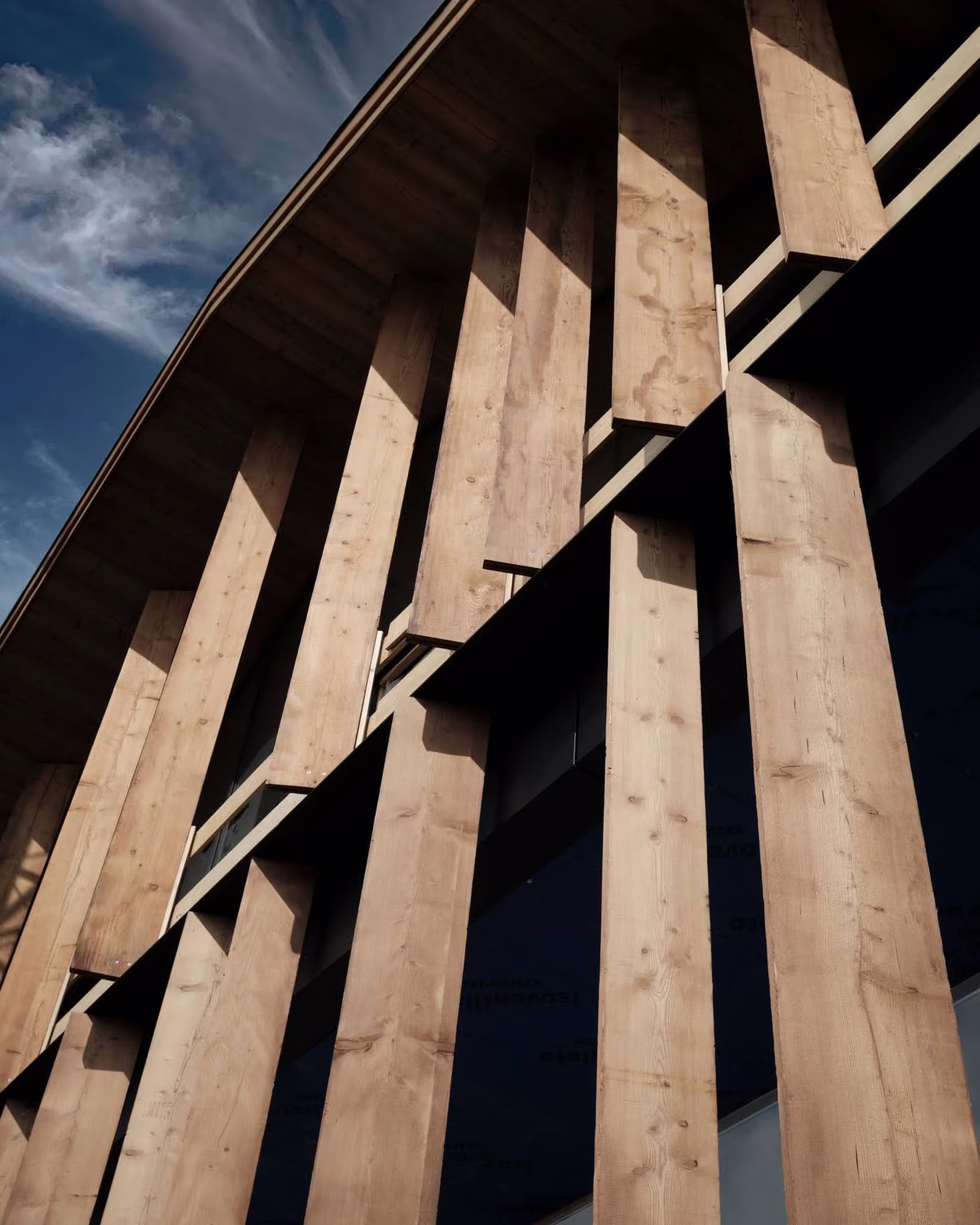 Close view of the hotel's vertical timber façade.